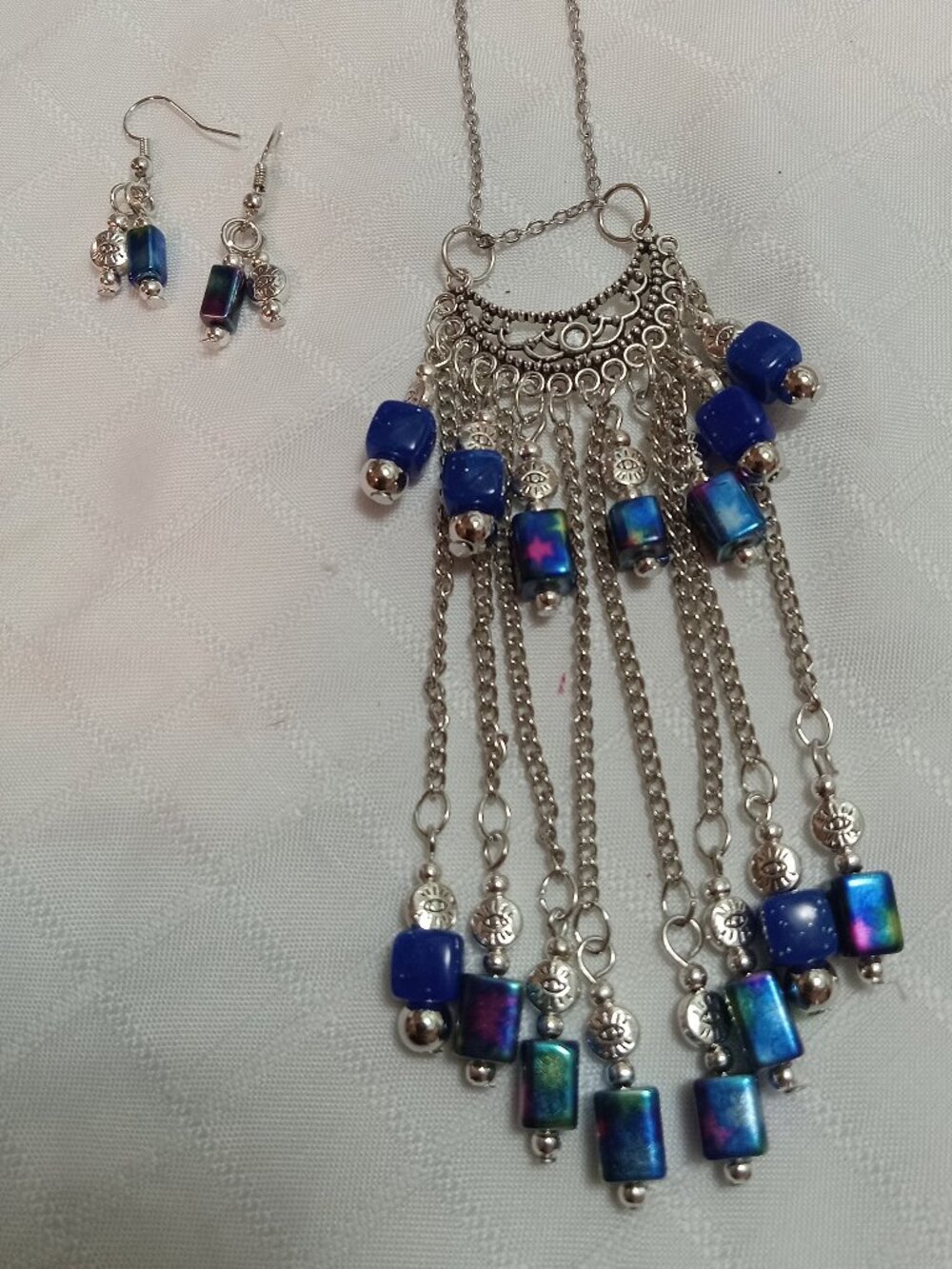 Exquisite handmade necklace featuring a half-moon-shaped charm & earrings